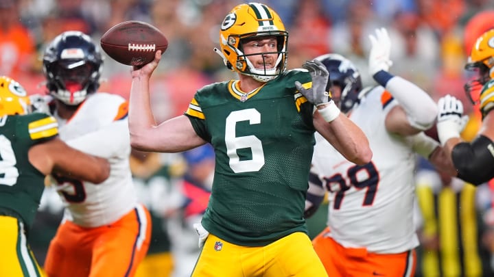 Aug 18, 2024; Denver, Colorado, USA; Green Bay Packers quarterback Sean Clifford (6) prepares to pass the ball in the first quarter against the Denver Broncos at Empower Field at Mile High. Mandatory Credit: Ron Chenoy-USA TODAY Sports