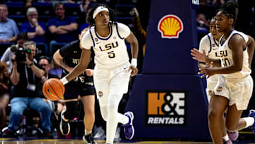 Nov 8, 2024; Baton Rouge, Louisiana, USA;  LSU Lady Tigers forward Sa'Myah Smith (5) brings the ball up court against the Northwestern State Lady Demons during the first half at Pete Maravich Assembly Center. Mandatory Credit: Stephen Lew-Imagn Images