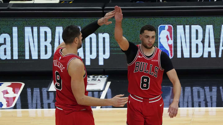 May 7, 2021; Chicago, Illinois, USA; Chicago Bulls guard Zach LaVine (8) celebrates his three point basket against the Boston Celtics with center Nikola Vucevic (9) during the second half at United Center.