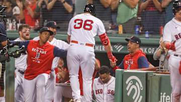 Sep 13, 2022; Boston, Massachusetts, USA; Boston Red Sox manager Alex Cora (13) celebrates with Boston Red Sox first baseman Triston Casas (36) after a home run by Casas during the second inning against the New York Yankees at Fenway Park. Mandatory Credit: Paul Rutherford-Imagn Images