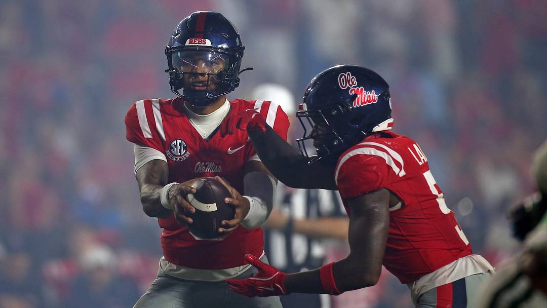 Sep 12, 2026; Oxford, Mississippi, USA; Mississippi Rebels quarterback Trinidad Chambliss (6) fakes the handoff to running back Kewan Lacy (5) during the fourth quarter against the Charlotte 49ers at Vaught-Hemingway Stadium. Mandatory Credit: Petre Thomas-Imagn Images Sep 12, 2026; Oxford, Mississippi, USA; Mississippi Rebels quarterback Trinidad Chambliss (6) fakes the handoff to running back Kewan Lacy (5) during the fourth quarter against the Charlotte 49ers at Vaught-Hemingway Stadium. Mandatory Credit: Petre Thomas-Imagn Images