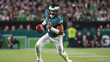 Sep 16, 2024; Philadelphia, Pennsylvania, USA; Philadelphia Eagles quarterback Jalen Hurts (1) runs with the football against the Atlanta Falcons at Lincoln Financial Field. Mandatory Credit: Eric Hartline-Imagn Images