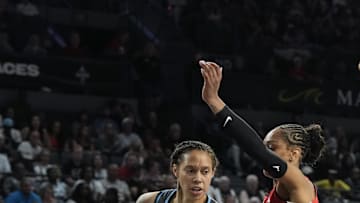 Jul 22, 2025; Las Vegas, Nevada, USA; Atlanta Dream center Brittney Griner (42) drives against Las Vegas Aces center A'ja Wilson (22) in the third quarter of their game at Michelob Ultra Arena. Mandatory Credit: Candice Ward-Imagn Images