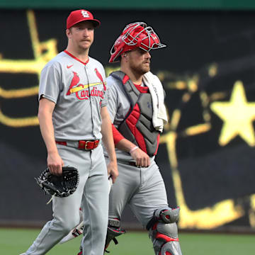 Jun 30, 2025; Pittsburgh, Pennsylvania, USA;  St. Louis Cardinals starting pitcher Erick Fedde (12) and catcher Pedro Pages (43) make their way in from the bullpen to play the Pittsburgh Pirates at PNC Park. Mandatory Credit: Charles LeClaire-Imagn Images