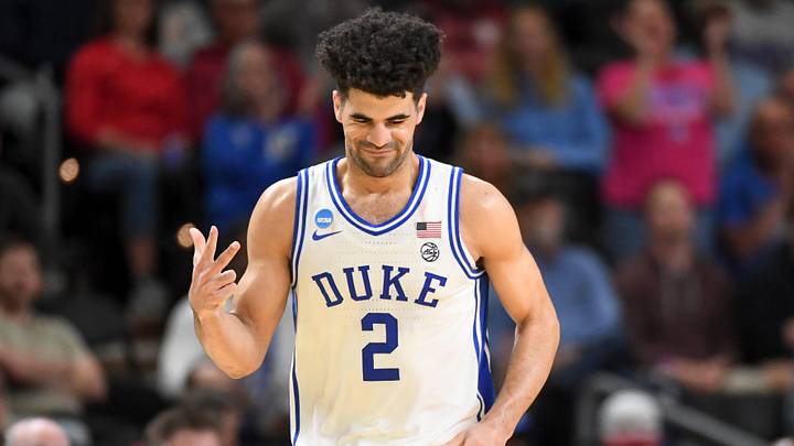 Duke basketball guard Cayden Boozer (2) reacts after scoring Thursday, March 19, 2026, during the NCAA Men’s Basketball Tournament first round game against the Siena Saints at Bon Secours Wellness Arena in Greenville, South Carolina. Duke Blue Devils won 71-65.