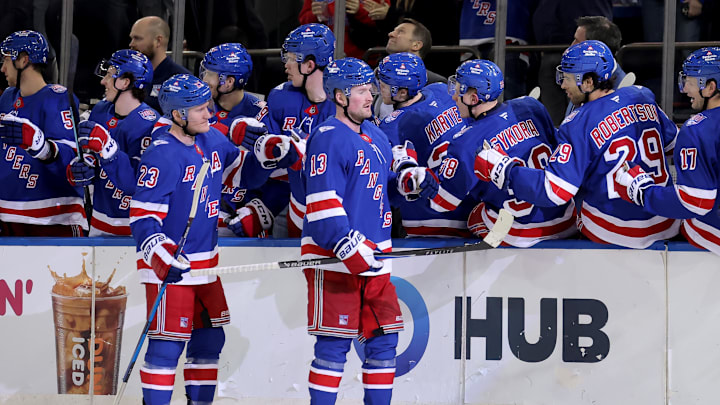Mar 27, 2026; New York, New York, USA; New York Rangers left wing Alexis Lafreniere (13) celebrates his goal against the Chicago Blackhawks with teammates during the third period at Madison Square Garden. 
