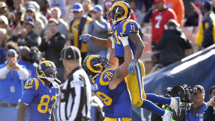 December 24, 2016; Los Angeles, CA, USA;  Los Angeles Rams wide receiver Tavon Austin (11) celebrates with offensive tackle Rob Havenstein (79) and wide receiver Brian Quick (83) his touchdown scored against the San Francisco 49ers during the first half at Los Angeles Memorial Coliseum. Mandatory Credit: Gary A. Vasquez-USA TODAY Sports