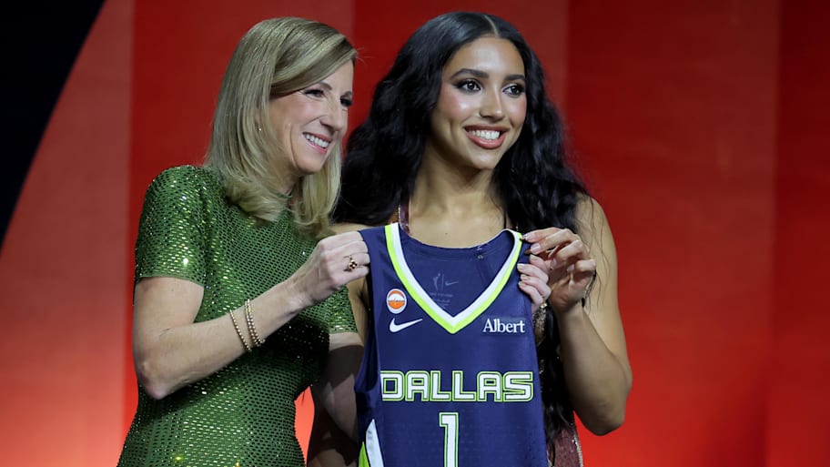 WNBA Commissioner Cathy Engelbert poses for photos with Azzi Fudd
