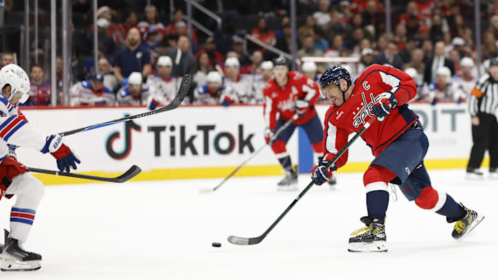 Dec 23, 2025; Washington, District of Columbia, USA; Washington Capitals left wing Alex Ovechkin (8) shoots the puck against the New York Rangers during the third period at Capital One Arena. Mandatory Credit: Geoff Burke-Imagn Images