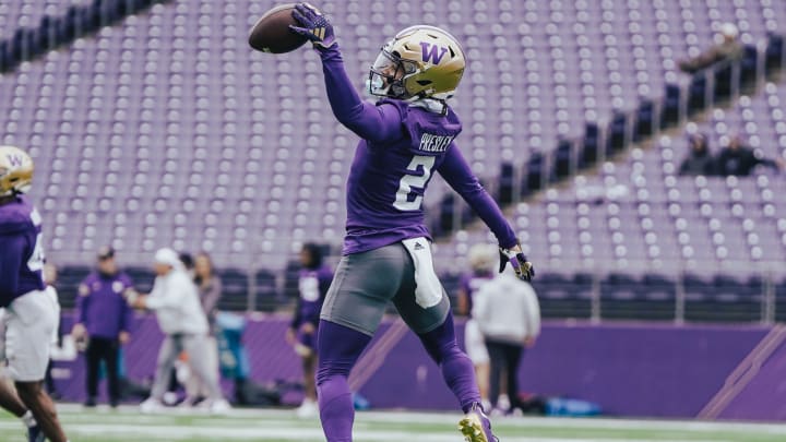 Caleb Presley makes a coverage play in UW football practice. 