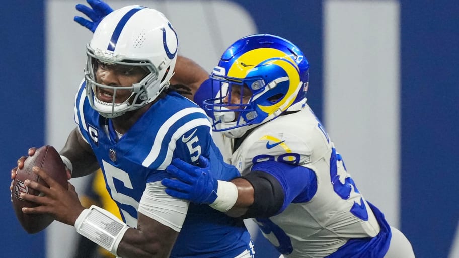 Indianapolis Colts quarterback Anthony Richardson (5) evades this tackler on a third quarter scramble during game action against the Los Angeles Rams at Indianapolis Colts, on Sunday, Oct. 1, 2023, at Lucas Oil Stadium in Indianapolis. | Robert Scheer/IndyStar / USA TODAY