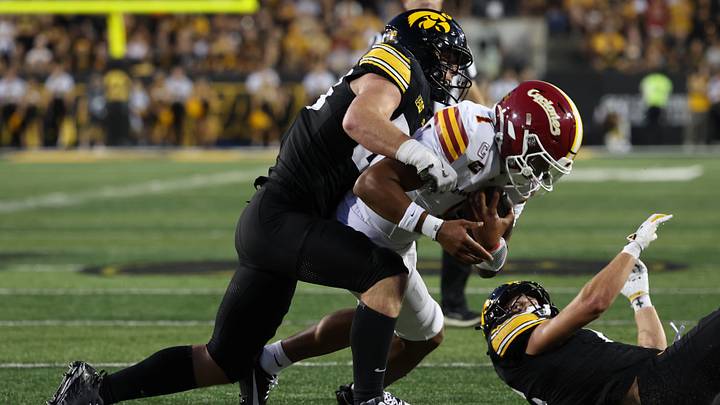 Sep 12, 2026; Iowa City, Iowa, USA;  Iowa State Cyclones quarterback Jaylen Raynor (1) is tackled short of the goal line by the Iowa Hawkeye defense during the second quarter at Kinnick Stadium.  Mandatory Credit: Reese Strickland-Imagn Images