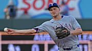 Aug 19, 2025; Kansas City, Missouri, USA;  Texas Rangers shortstop Corey Seager (5) throws to first base in the fourth inning against the Kansas City Royals at Kauffman Stadium. Mandatory Credit: Peter Aiken-Imagn Images