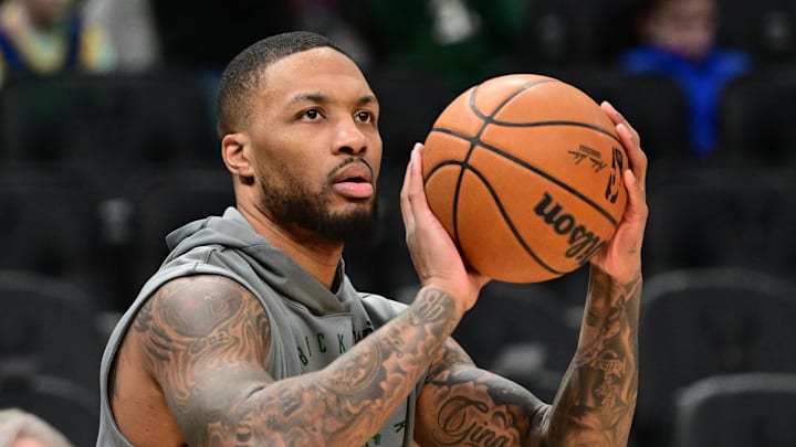 Milwaukee Bucks guard Damian Lillard warms up before a game.