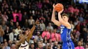 Feb 7, 2024; Providence, Rhode Island, USA; Creighton Bluejays guard Baylor Scheierman (55)  shoots over Providence Friars guard Jayden Pierre (1)  during overtime at Amica Mutual Pavilion. Mandatory Credit: Eric Canha-USA TODAY Sports