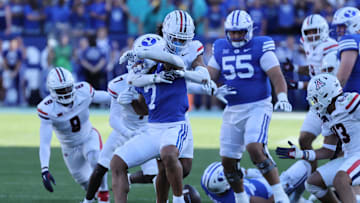 Oct 12, 2024; Provo, Utah, USA; Brigham Young Cougars running back Hinckley Ropati (7) fumbles the ball against the Arizona Wildcats during the fourth quarter at LaVell Edwards Stadium. Mandatory Credit: Rob Gray-Imagn Images