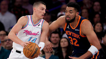 Mar 17, 2025; New York, New York, USA; Miami Heat guard Tyler Herro (14) drives to the basket against New York Knicks center Karl-Anthony Towns (32) during the first quarter at Madison Square Garden. Mandatory Credit: Brad Penner-Imagn Images
