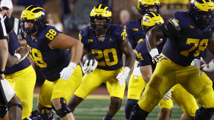 Aug 31, 2024; Ann Arbor, Michigan, USA;  Michigan Wolverines running back Kalel Mullings (20) rushes against the Fresno State Bulldogs in the first half at Michigan Stadium. Mandatory Credit: Rick Osentoski-Imagn Images