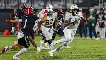 Aug 28, 2025; Orlando, Florida, USA; UCF Knights tight end Kylan Fox (1) carries the ball during the second quarter against the Jacksonville State Gamecocks at Acrisure Bounce House. Mandatory Credit: Mike Watters-Imagn Images