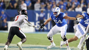 Oct 21, 2023; Provo, Utah, USA; Brigham Young Cougars offensive lineman Paul Maile (54) blocks Texas Tech Red Raiders linebacker Bryce Ramirez (3) in the second half at LaVell Edwards Stadium. Mandatory Credit: Rob Gray-Imagn Images
