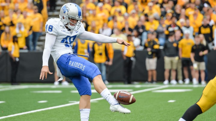 Middle Tennessee punter Kyle Ulbrich punts the ball against the Iowa Hawkeyes at Kinnick Stadium.