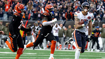 Chicago Bears tight end Colston Loveland (84) catches a pass and runs for a go ahead touchdown as Cincinnati Bengals linebacker Demetrius Knight Jr. (44) and Cincinnati Bengals cornerback Josh Newton (28) attempt to stop him in the fourth quarter of the NFL football game between Chicago Bears and Cincinnati Bengals at Paycor Stadium in Cincinnati on Nov. 2, 2025.