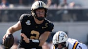 Vanderbilt quarterback Diego Pavia runs the ball 