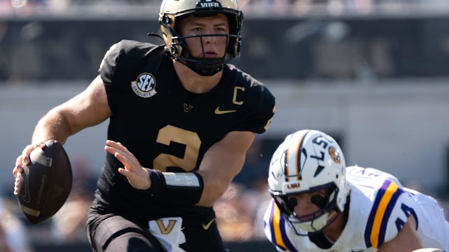 Vanderbilt quarterback Diego Pavia runs the ball.