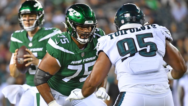 Aug 12, 2022; Philadelphia, Pennsylvania, USA; New York Jets guard Alijah Vera-Tucker (75) blocks Philadelphia Eagles defensive tackle Marlon Tuipulotu (95) at Lincoln Financial Field.