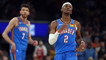 Apr 24, 2025; Memphis, Tennessee, USA; Oklahoma City Thunder guard Shai Gilgeous-Alexander (2) and forward Chet Holmgren (7) look on during the second quarter against the Memphis Grizzlies during Game 3 of the first round of the 2025 NBA Playoffs at FedExForum.