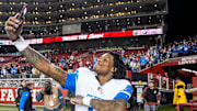 Detroit Lions wide receiver Jameson Williams (9) takes a selfie to celebrate 40-34 win over San Francisco 49ers 