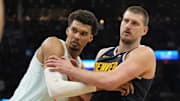 Jan 4, 2025; San Antonio, Texas, USA; San Antonio Spurs center Victor Wembanyama (1) and Denver Nuggets center Nikola Jokic (15) battle for position during an inbound pass in the second half at Frost Bank Center.