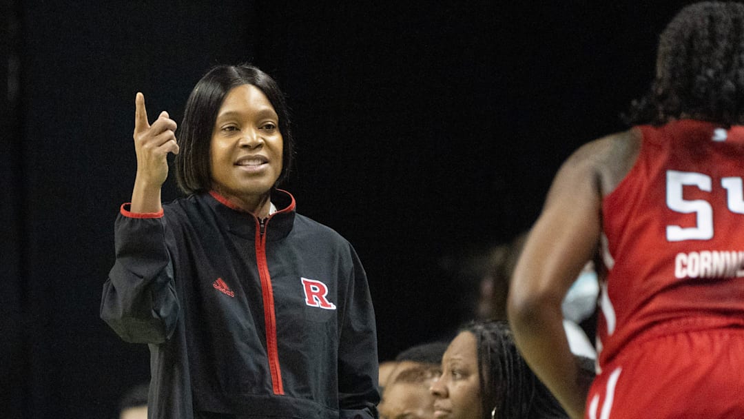 Rutgers coach Coquese Washington gestures to her team during the first half against Oregon. Rutgers coach Coquese Washington gestures to her team during the first half against Oregon.