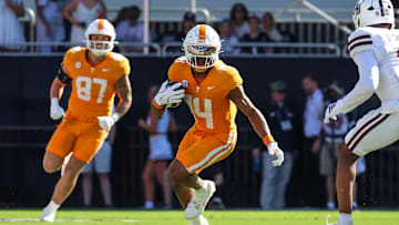 Sep 27, 2025; Starkville, Mississippi, USA; Tennessee Volunteers wide receiver Braylon Staley (14) runs with the ball against the Mississippi State Bulldogs during the first half at Davis Wade Stadium at Scott Field. Mandatory Credit: Wesley Hale-Imagn Images
