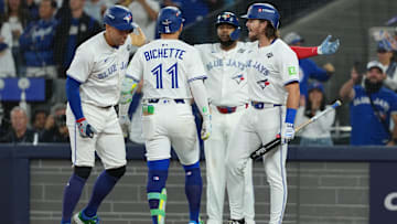 Nov 1, 2025; Toronto, Ontario, CAN; Toronto Blue Jays shortstop Bo Bichette (11) reacts after hitting a three run home run against the Los Angeles Dodgers in the third inning for game seven of the 2025 MLB World Series at Rogers Centre.