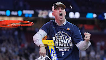 Apr 8, 2024; Glendale, AZ, USA;  Connecticut Huskies head coach Dan Hurley celebrates after cutting down the net after defeating the Purdue Boilermakers in the national championship game of the Final Four of the 2024 NCAA Tournament at State Farm Stadium. Mandatory Credit: Robert Deutsch-Imagn Images