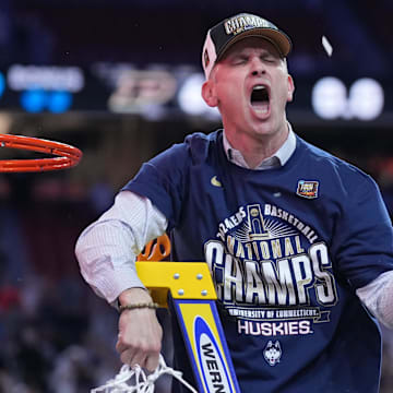 Apr 8, 2024; Glendale, AZ, USA;  Connecticut Huskies head coach Dan Hurley celebrates after cutting down the net after defeating the Purdue Boilermakers in the national championship game of the Final Four of the 2024 NCAA Tournament at State Farm Stadium. Mandatory Credit: Robert Deutsch-Imagn Images