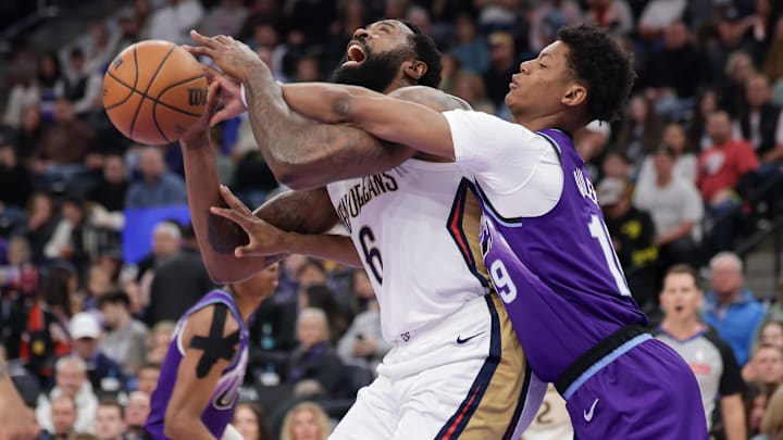 Feb 28, 2026; Salt Lake City, Utah, USA;  New Orleans Pelicans center DeAndre Jordan (6) is fouled by Utah Jazz forward Ace Bailey (19) during the first quarter at Delta Center. Mandatory Credit: Chris Nicoll-Imagn Images