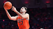 Nov 22, 2025; Champaign, Illinois, USA;  Illinois Fighting Illini guard Mihailo Petrovic (77) drives to the basket during the first half against the Long Island University Sharks at State Farm Center. Mandatory Credit: Ron Johnson-Imagn Images