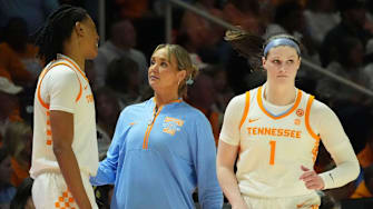 Tennessee basketball coach Kim Caldwell talks with Zee Spearman (11) as she and Sara Puckett (1) sub out during an NCAA college basketball game against Georgia on Sunday, March 2, 2025, in Knoxville, Tenn.