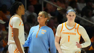 Tennessee basketball coach Kim Caldwell talks with Zee Spearman (11) as she and Sara Puckett (1) sub out during an NCAA college basketball game against Georgia on Sunday, March 2, 2025, in Knoxville, Tenn.