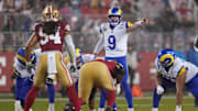 Dec 12, 2024; Santa Clara, California, USA; Los Angeles Rams quarterback Matthew Stafford (9) directs teammates before a play against the San Francisco 49ers in the second quarter at Levi's Stadium. Mandatory Credit: Cary Edmondson-Imagn Images
