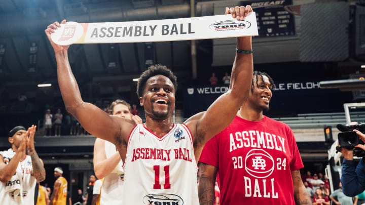 Yogi Ferrell (left) and Troy Williams (right) celebrate Assembly Ball's win over The Cru in The Basketball Tournament.