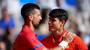 Aug 4, 2024; Paris, France; Novak Djokovic (SRB) greets Carlos Alcaraz (ESP) after winning the men’s singles gold medal match during the Paris 2024 Olympic Summer Games at Stade Roland Garros. 