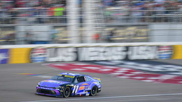 Oct 12, 2025; Las Vegas, Nevada, USA; NASCAR Cup Series driver Denny Hamlin (11) crosses the finish line to win the South Point 400 at Las Vegas Motor Speedway.