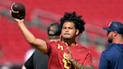 Sep 6, 2025; Los Angeles, California, USA;  USC Trojans quarterback Jayden Maiava (14) warms up prior to the game against the Georgia Southern Eagles at United Airlines Field at Los Angeles Memorial Coliseum. Mandatory Credit: Jayne Kamin-Oncea-Imagn Images