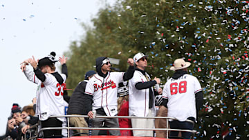 Nov 5, 2021; Atlanta, GA, USA; Atlanta Braves players from left A.J. Minter , Josh Tomlin, Luke Jackson and Tyler Matzek wave to the crowd during the World Series championship parade at Truist Park. Mandatory Credit: Brett Davis-Imagn Images