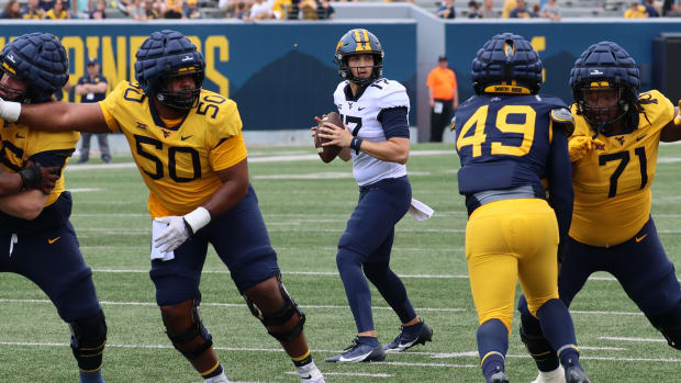West Virginia University redshirt junior quarterback Jackson Crist drops back to pass in the 2024 Gold-Blue Spring Game.