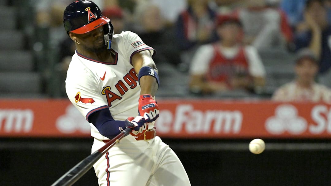 Jul 9, 2025; Anaheim, California, USA;  Los Angeles Angels right fielder Jorge Soler (12) hits a two-run home run in the eighth inning against the Texas Rangers at Angel Stadium. Mandatory Credit: Jayne Kamin-Oncea-Imagn Images