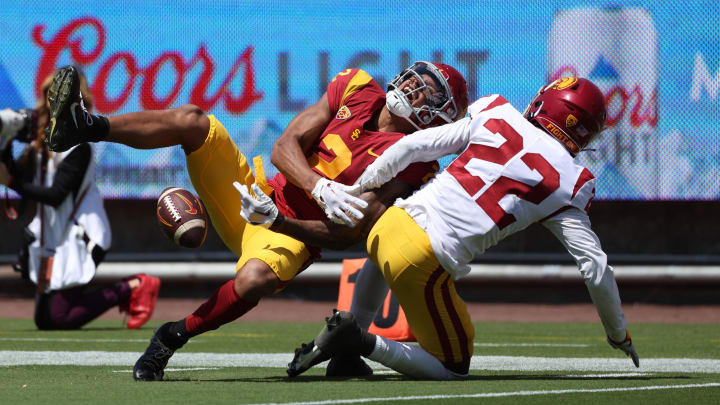 Apr 15, 2023; Los Angeles, CA, USA;  USC Trojans wide receiver Brenden Rice (2) and defensive back Ceyair Wright (22) fight for a pass during the Spring Game at Los Angeles Memorial Coliseum. 